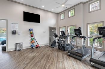 Gym equipped with cardio equipment at The Enclave at Crossroads, North Carolina